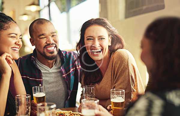 Friends laughing over board games