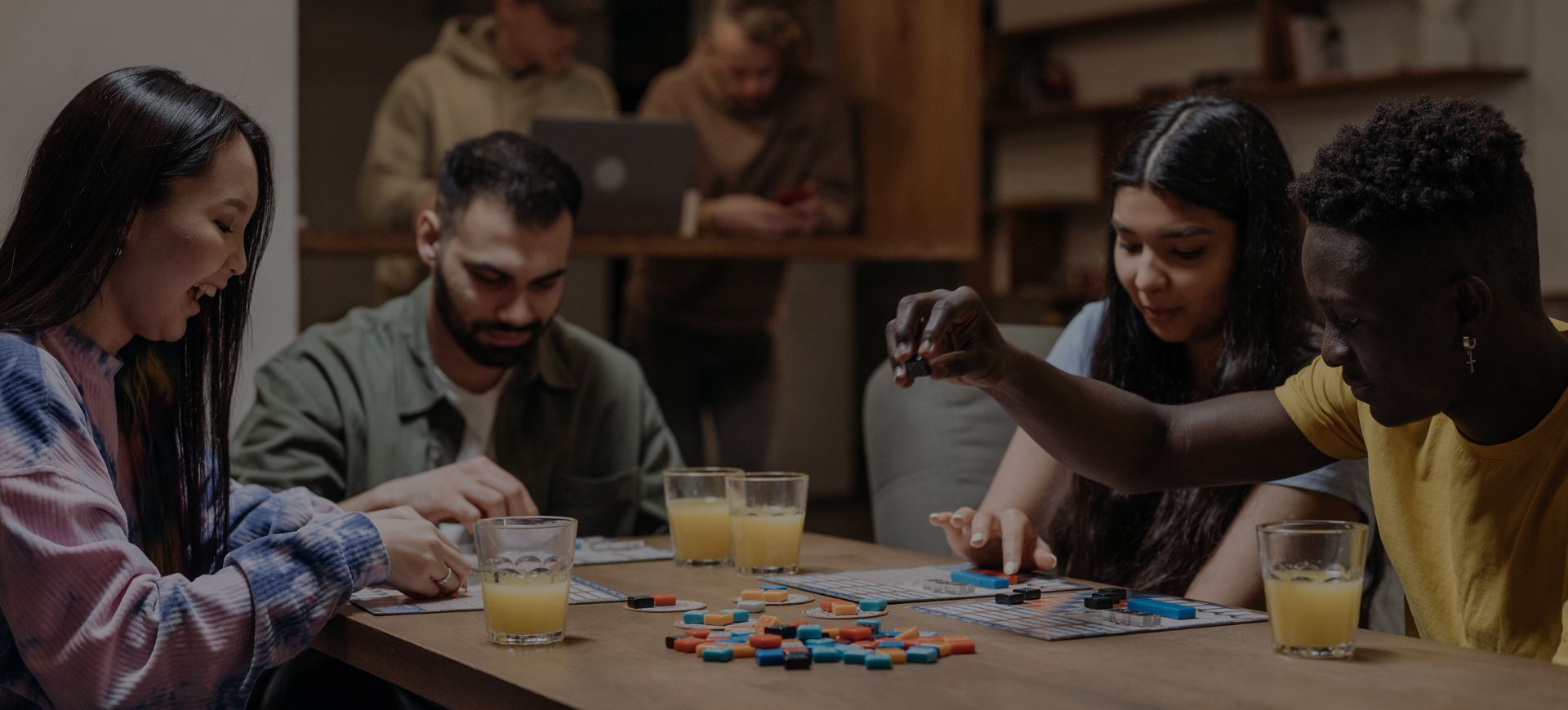 Friends playing board games at Board & Brewed